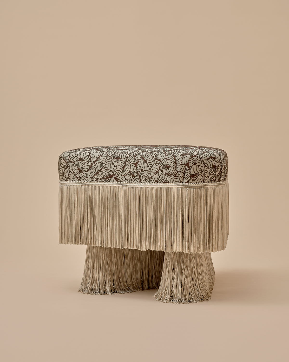 Nerova Ottoman by Love House x Spencer Malinski, view of one straight side with the fringe skirt and legs, available at Love House New York