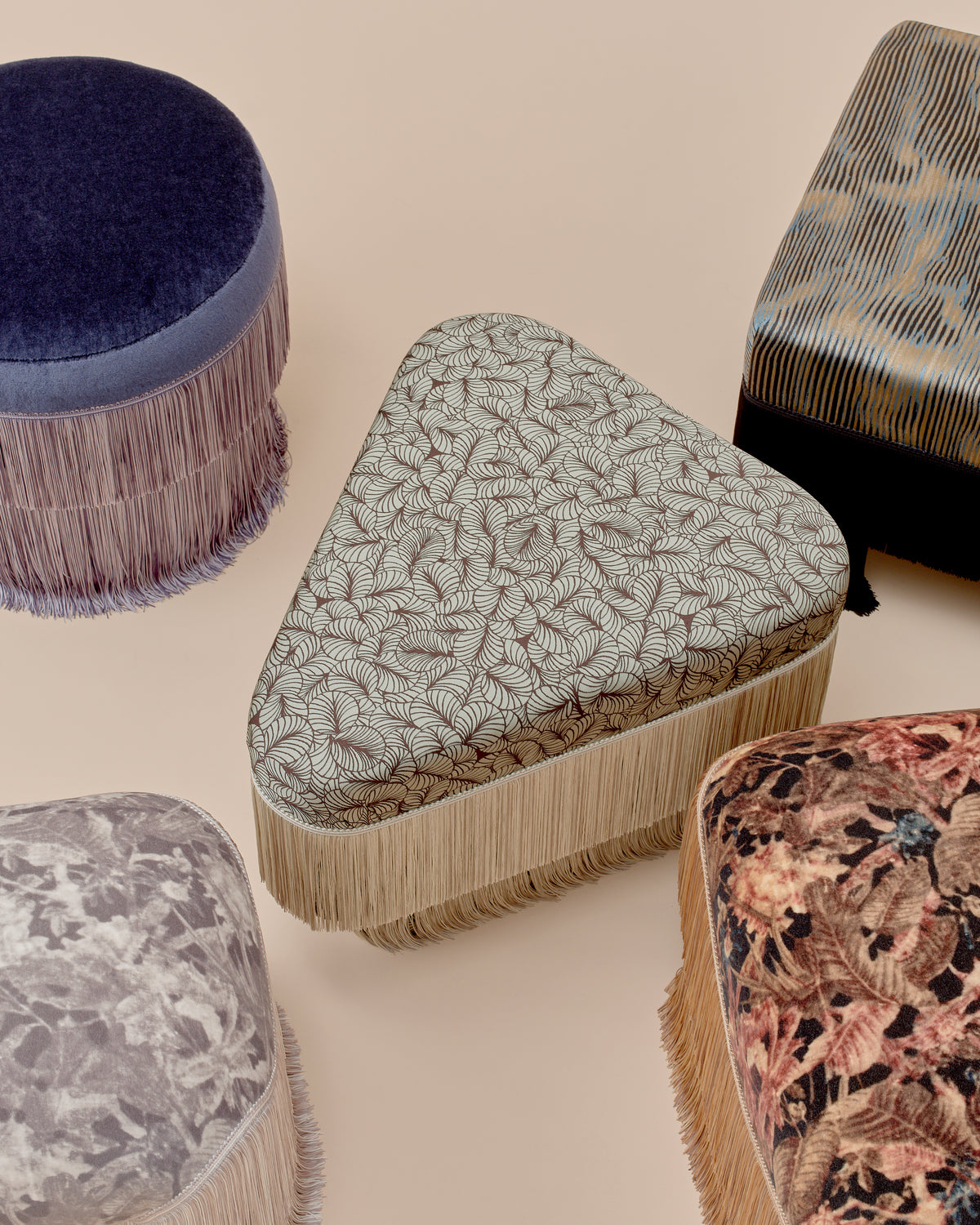 Nerova Ottoman by Love House x Spencer Malinski, seen from above with the other ottomans in the collection grouped around it, available at Love House New York